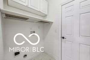 19146 Carol Cove Cir, Noblesville, IN 46062 - laundry area with cabinet space, washer hookup, and tile patterned floors