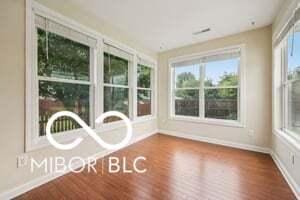 19146 Carol Cove Cir, Noblesville, IN 46062 - unfurnished sunroom with baseboards and wood finished floors