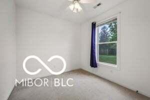 19146 Carol Cove Cir, Noblesville, IN 46062 - carpeted empty room featuring a ceiling fan