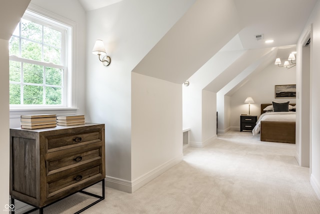 7105 Sylvan Ridge Rd, Indianapolis, IN 46240 - bedroom featuring vaulted ceiling, light colored carpet, multiple windows, a chandelier, and baseboards