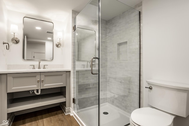 7105 Sylvan Ridge Rd, Indianapolis, IN 46240 - full bathroom with toilet, vanity, a shower stall, and wood finished floors