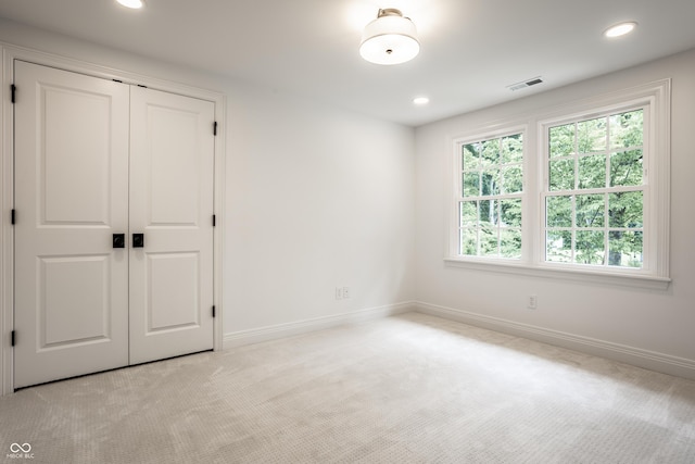 7105 Sylvan Ridge Rd, Indianapolis, IN 46240 - unfurnished bedroom featuring light carpet, baseboards, a closet, and recessed lighting