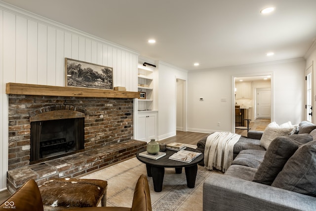 7105 Sylvan Ridge Rd, Indianapolis, IN 46240 - living room featuring crown molding, baseboards, wood finished floors, recessed lighting, and built in features