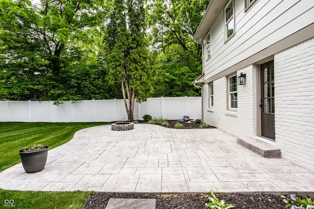 7105 Sylvan Ridge Rd, Indianapolis, IN 46240 - view of patio with a fire pit