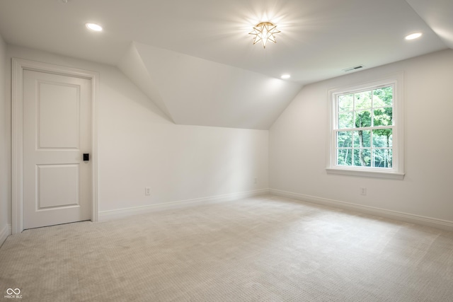 7105 Sylvan Ridge Rd, Indianapolis, IN 46240 - additional living space featuring light carpet, vaulted ceiling, recessed lighting, and baseboards