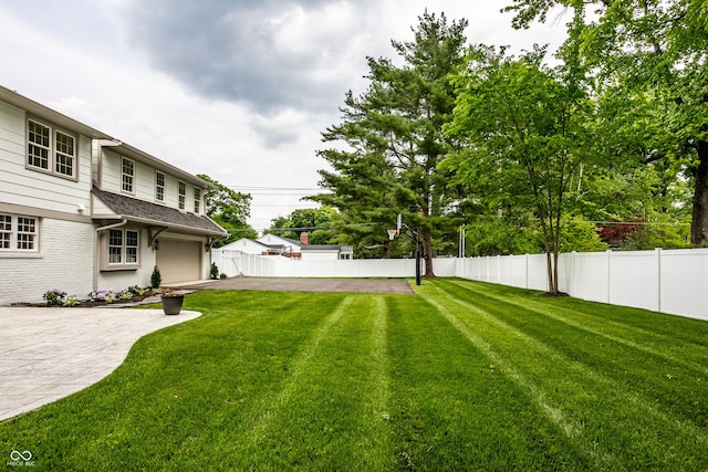 7105 Sylvan Ridge Rd, Indianapolis, IN 46240 - view of yard featuring driveway and a garage