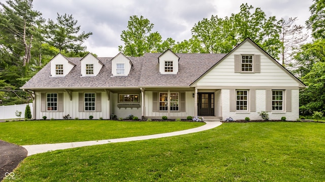 7105 Sylvan Ridge Rd, Indianapolis, IN 46240 - cape cod-style house with roof with shingles, board and batten siding, and brick siding