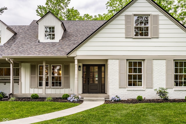 7105 Sylvan Ridge Rd, Indianapolis, IN 46240 - view of front of property with a shingled roof, covered porch, and a front lawn