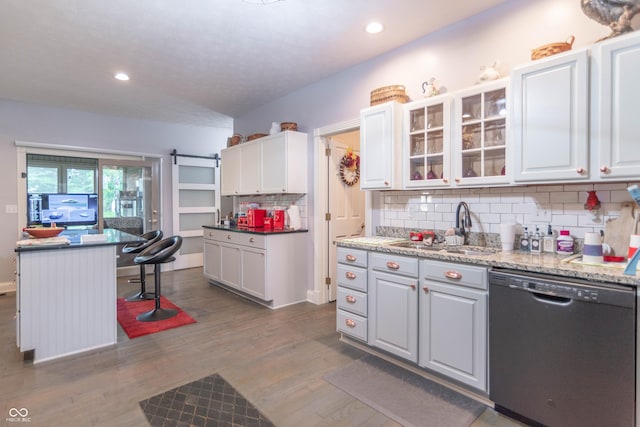 505 Jones Pl, Martinsville, IN 46151 - kitchen featuring dishwasher, a sink, tasteful backsplash, dark wood finished floors, and white cabinetry