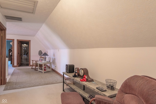 505 Jones Pl, Martinsville, IN 46151 - sitting room featuring carpet floors, vaulted ceiling, a textured ceiling, and baseboards