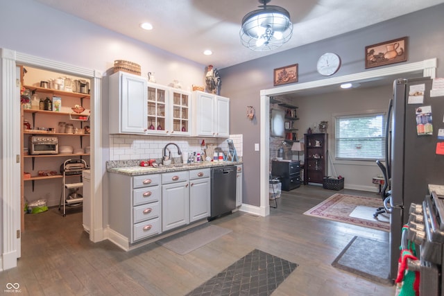 505 Jones Pl, Martinsville, IN 46151 - kitchen with dishwashing machine, dark wood-type flooring, a sink, decorative backsplash, and recessed lighting