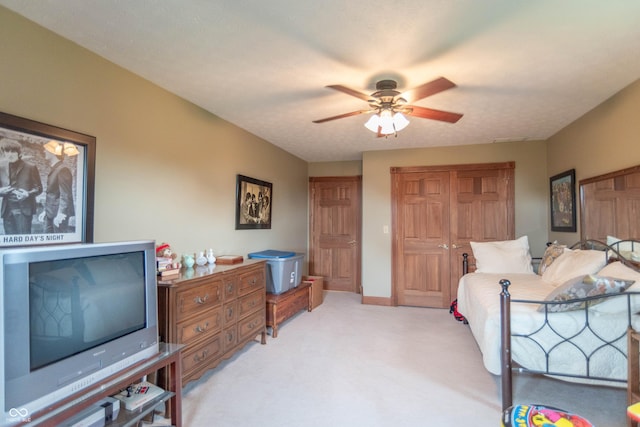 505 Jones Pl, Martinsville, IN 46151 - bedroom with light colored carpet, a closet, ceiling fan, and baseboards