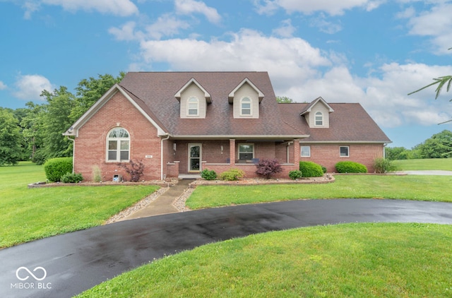 505 Jones Pl, Martinsville, IN 46151 - cape cod home featuring brick siding, a front lawn, and a shingled roof