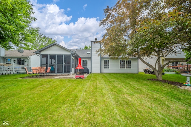 441 E Pine Ridge Dr, Westfield, IN 46074 - rear view of house featuring a patio area, a chimney, and a sunroom