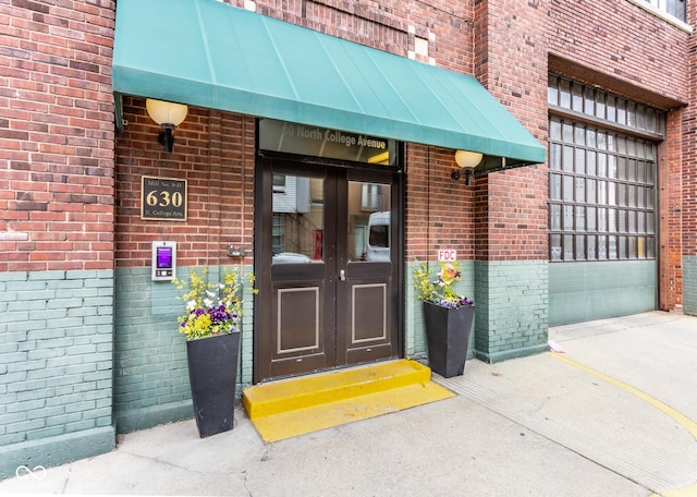 630 N College Ave Unit 409, Indianapolis, IN 46204 - property entrance featuring french doors and brick siding
