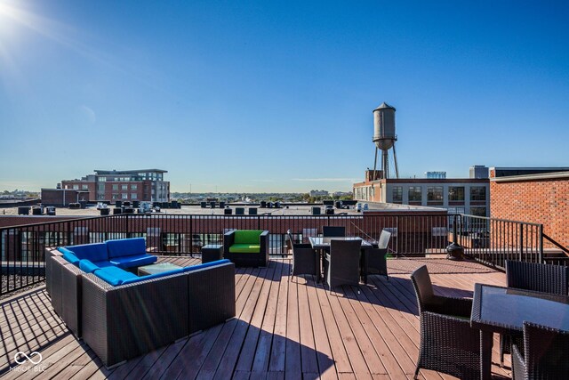 630 N College Ave Unit 409, Indianapolis, IN 46204 - wooden terrace featuring outdoor lounge area and outdoor dining space