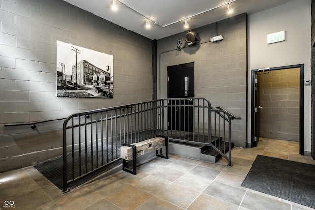 630 N College Ave Unit 409, Indianapolis, IN 46204 - staircase with track lighting