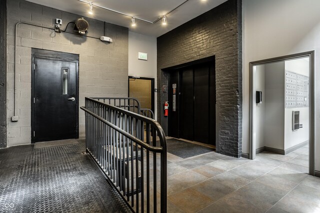 630 N College Ave Unit 409, Indianapolis, IN 46204 - entryway with rail lighting and elevator