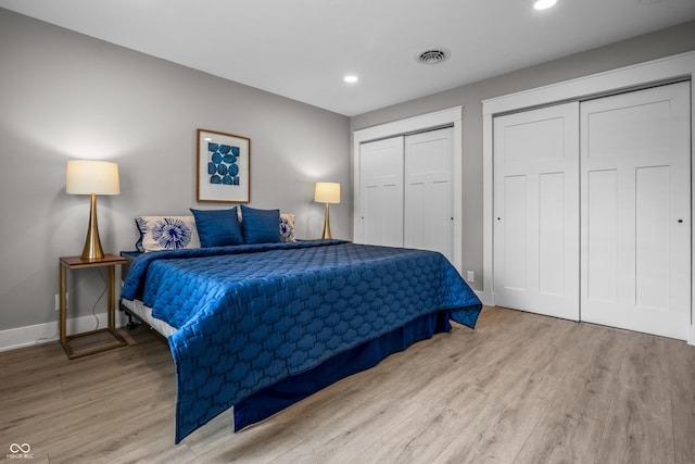 2537 N Boehning St, Indianapolis, IN 46219 - bedroom with wood finished floors, multiple closets, baseboards, and recessed lighting