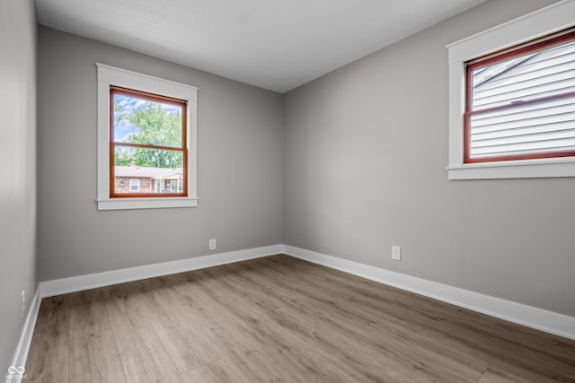 2537 N Boehning St, Indianapolis, IN 46219 - empty room with wood finished floors and baseboards