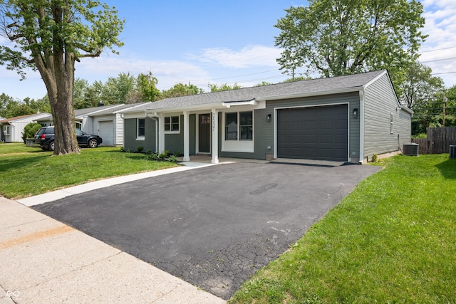 2537 N Boehning St, Indianapolis, IN 46219 - single story home with an attached garage, driveway, and central air condition unit