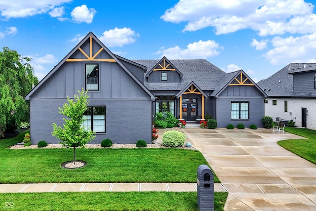 1135 Maclaren Ct, Franklin, IN 46131 - modern farmhouse style home with board and batten siding, a front yard, french doors, brick siding, and roof with shingles