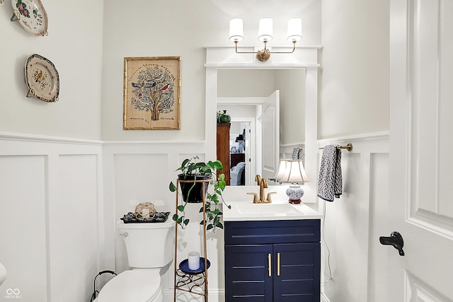 1135 Maclaren Ct, Franklin, IN 46131 - bathroom with a decorative wall, vanity, and a wainscoted wall