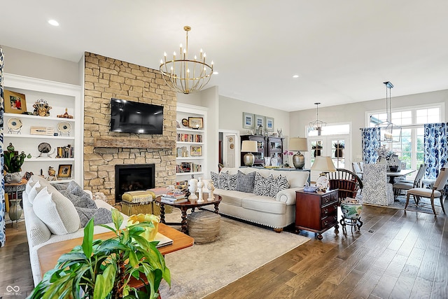 1135 Maclaren Ct, Franklin, IN 46131 - living area featuring a chandelier, dark wood finished floors, a fireplace, recessed lighting, and built in features