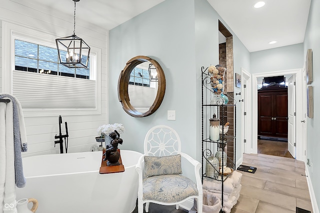 1135 Maclaren Ct, Franklin, IN 46131 - bathroom with a soaking tub, a chandelier, and recessed lighting