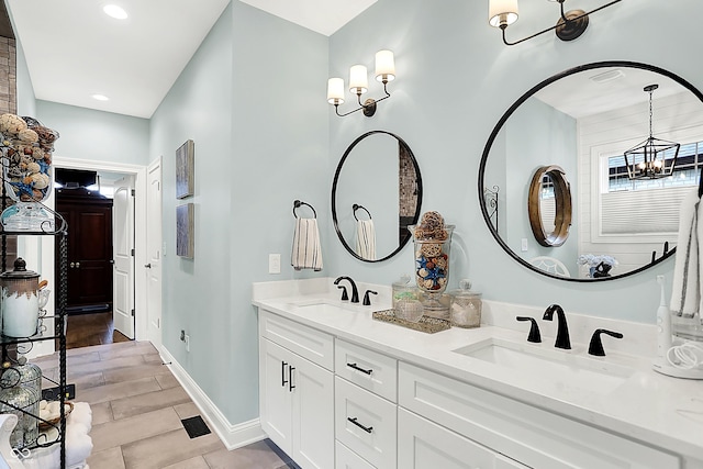 1135 Maclaren Ct, Franklin, IN 46131 - bathroom with a chandelier, double vanity, and recessed lighting
