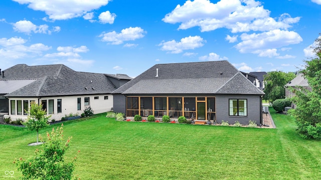1135 Maclaren Ct, Franklin, IN 46131 - rear view of property featuring a sunroom, a lawn, and roof with shingles