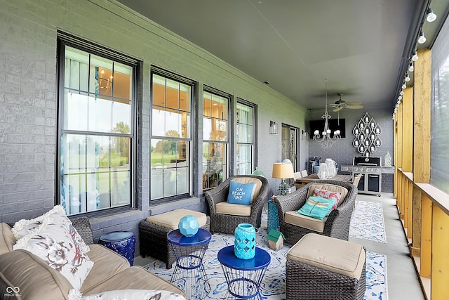 1135 Maclaren Ct, Franklin, IN 46131 - sunroom / solarium with a ceiling fan, a chandelier, and an outdoor hangout area