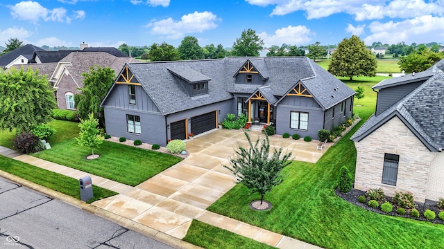 1135 Maclaren Ct, Franklin, IN 46131 - view of front facade featuring concrete driveway, board and batten siding, a front lawn, and stone siding
