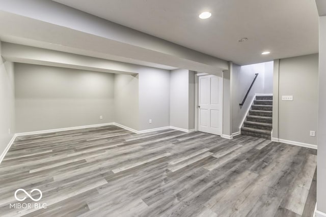 2502 Colinbrook Pkwy, Greenwood, IN 46143 - finished basement with wood finished floors, recessed lighting, baseboards, and stairway