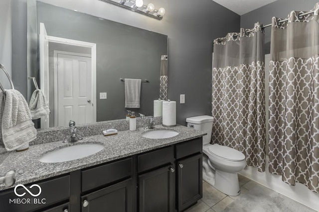 2502 Colinbrook Pkwy, Greenwood, IN 46143 - full bath featuring double vanity, toilet, tile patterned floors, and shower / tub combo with curtain
