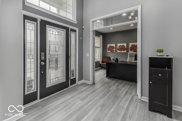 2502 Colinbrook Pkwy, Greenwood, IN 46143 - entryway with wood finished floors, baseboards, and a towering ceiling