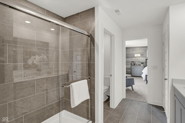 942 Shadow Dr, Danville, IN 46122 - ensuite bathroom featuring toilet, vanity, and a stall shower