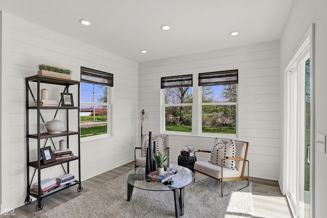 942 Shadow Dr, Danville, IN 46122 - living area with wood finished floors, wooden walls, and recessed lighting