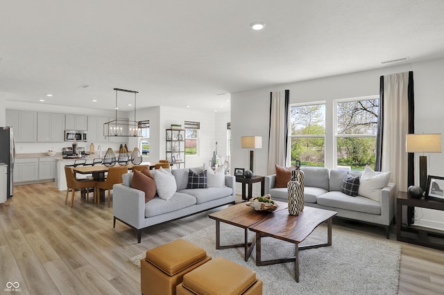 942 Shadow Dr, Danville, IN 46122 - living area featuring light wood-style flooring and recessed lighting