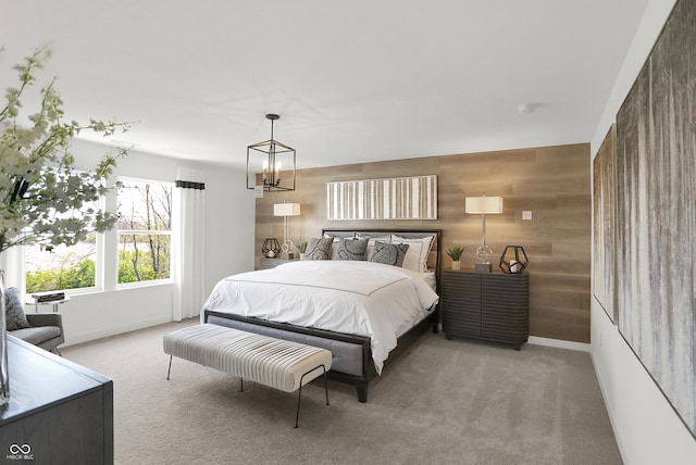 942 Shadow Dr, Danville, IN 46122 - bedroom with carpet floors, wood walls, a chandelier, and baseboards