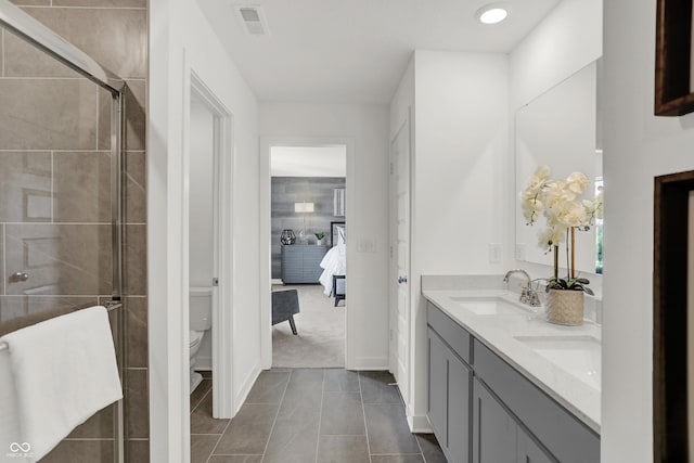942 Shadow Dr, Danville, IN 46122 - bathroom with ensuite bath, double vanity, toilet, a shower stall, and tile patterned flooring