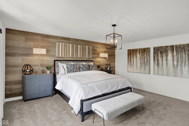 942 Shadow Dr, Danville, IN 46122 - bedroom featuring a chandelier, carpet floors, wood walls, and baseboards