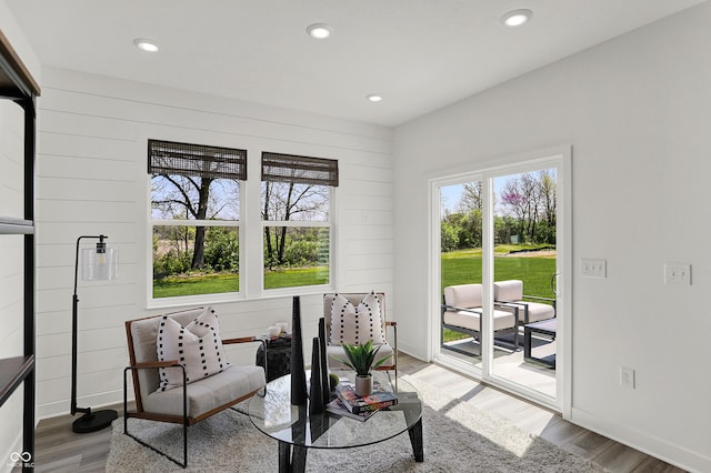 942 Shadow Dr, Danville, IN 46122 - living room with wood finished floors, recessed lighting, baseboards, and wooden walls