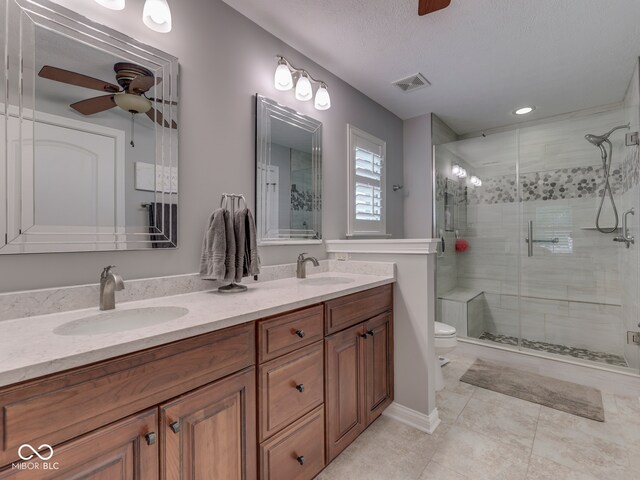 5351 Abbington Ave, Plainfield, IN 46168 - full bathroom with a ceiling fan, a stall shower, double vanity, tile patterned floors, and recessed lighting