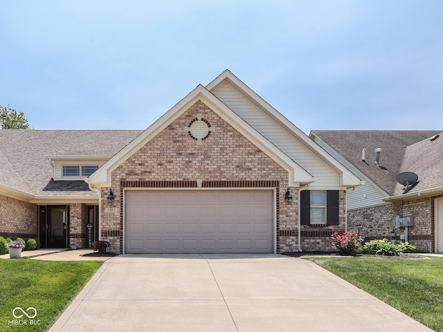5351 Abbington Ave, Plainfield, IN 46168 - view of front facade with brick siding, concrete driveway, and a garage