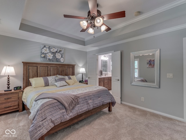 5351 Abbington Ave, Plainfield, IN 46168 - bedroom featuring light carpet, crown molding, a tray ceiling, connected bathroom, and ceiling fan