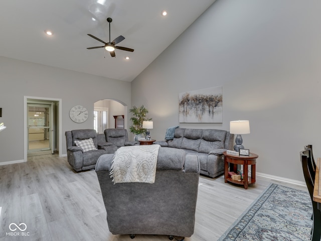 5351 Abbington Ave, Plainfield, IN 46168 - living area featuring arched walkways, a ceiling fan, high vaulted ceiling, light wood-style flooring, and recessed lighting