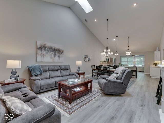 5351 Abbington Ave, Plainfield, IN 46168 - living room featuring high vaulted ceiling, a skylight, a chandelier, light wood-style flooring, and recessed lighting