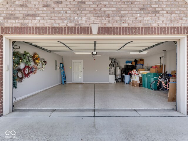 5351 Abbington Ave, Plainfield, IN 46168 - garage with gas water heater, electric panel, a garage door opener, and concrete driveway