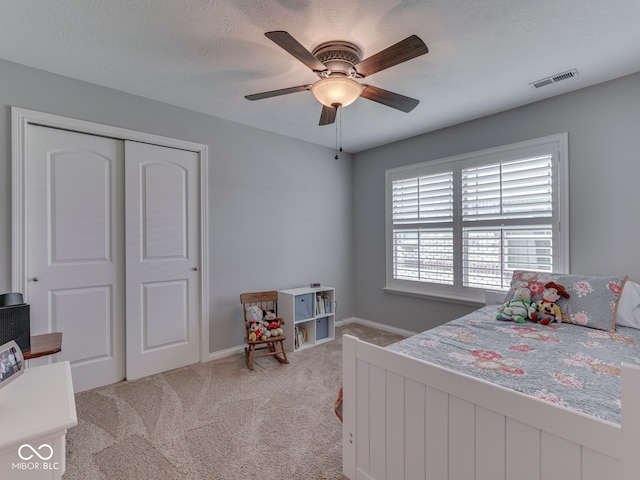5351 Abbington Ave, Plainfield, IN 46168 - bedroom with light colored carpet, a ceiling fan, and a closet